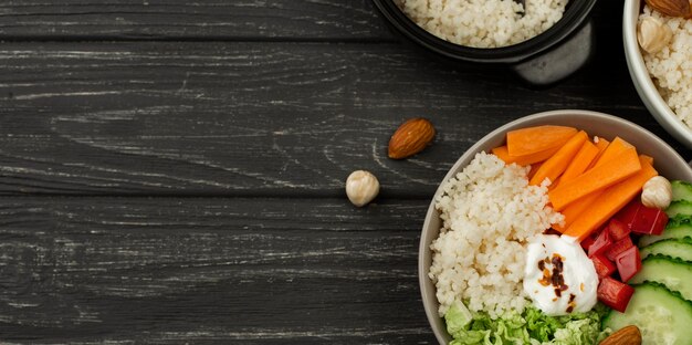 Flat lay veggie salad bowls with couscous and copy-space