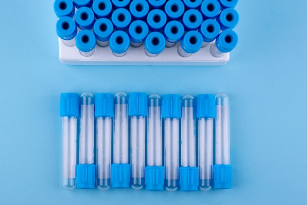 Free photo flat lay vials on blue background