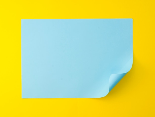 Flat lay of vibrant colored paper sheet with bent corner