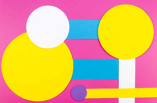 Flat lay of vibrant paper circles and shapes