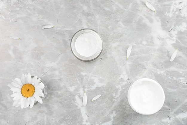 Flat lay view of natural cream on marble background