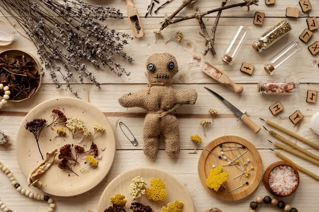 Flat lay voodoo doll and esoteric elements