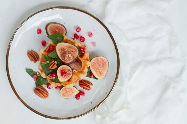 Flat lay waffles with figs and nuts