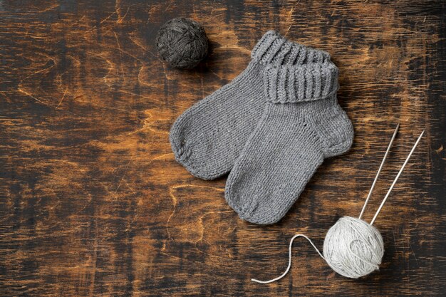 Flat lay warm socks on wooden table