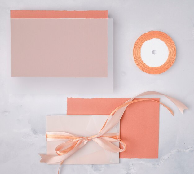 Flat lay wedding composition with minimalist invitations mock-up