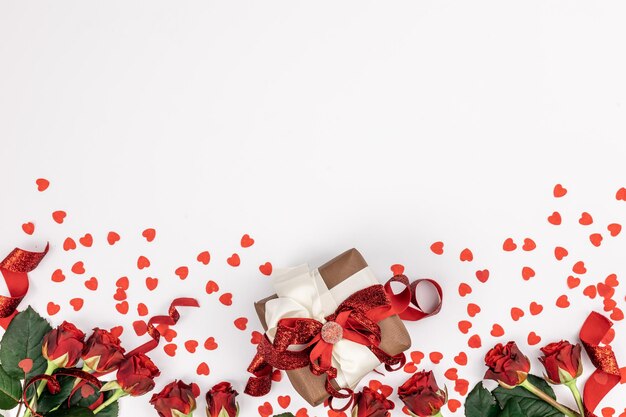 Flat lay white background with gift box and valentine's day decor details