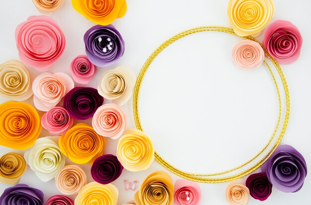 Flat lay white background with round paper flowers frame