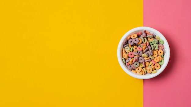 Flat lay white bowl with colorful cereals