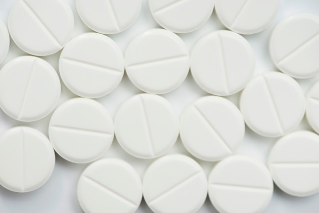 Flat lay white pills arrangement