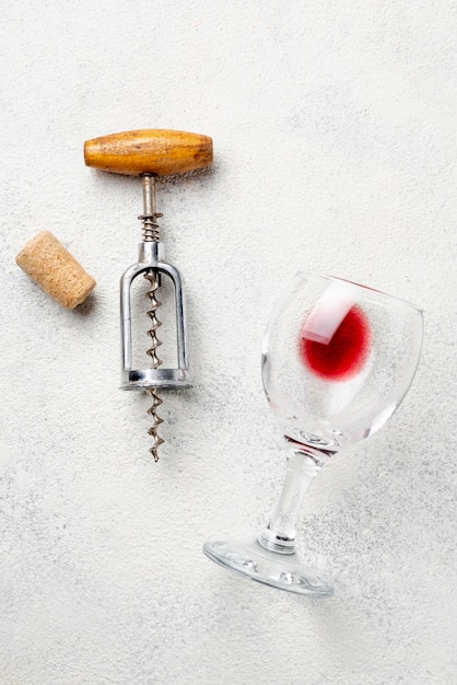 Flat lay wine glass and corkscrew