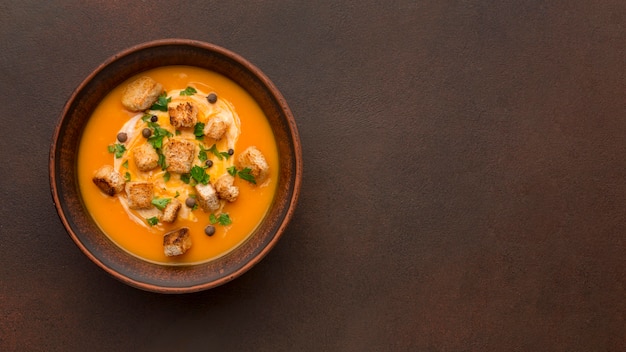 Flat lay of winter squash soup with copy space