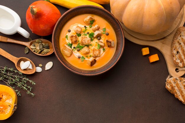 Flat lay of winter squash soup with croutons in bowl