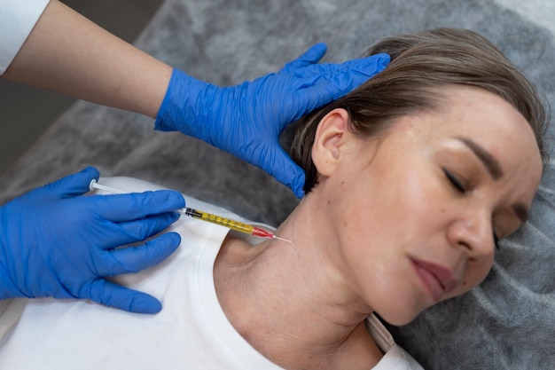 Free photo flat lay woman getting prp injection