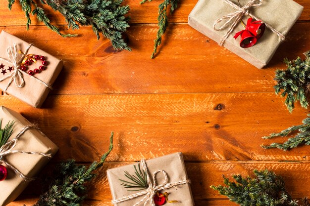 Flat lay wooden background with wrapped gifts