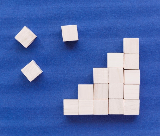 Free photo flat lay of wooden blocks