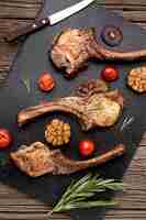 Free photo flat lay wooden board with cooked meat