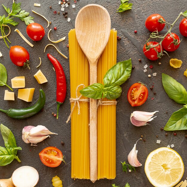 Flat lay of wooden spoon and ingredients