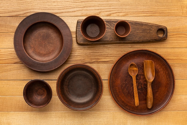 Free photo flat lay wooden tableware collection