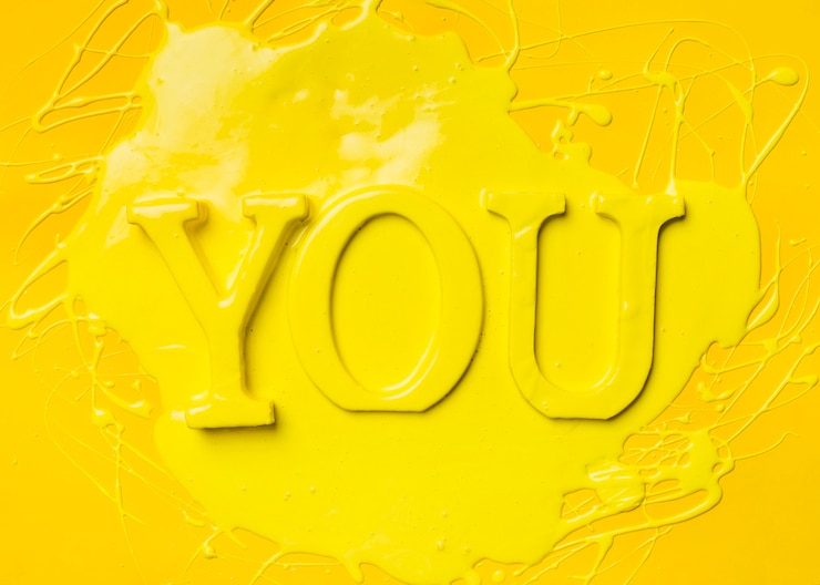 Free Photo flat lay of word you with paint