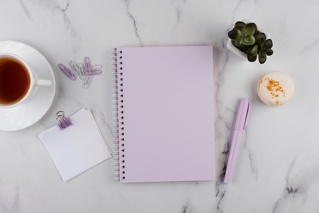 Flat lay workplace items on marble table