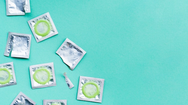 Free photo flat lay wrapped condoms with copy-space