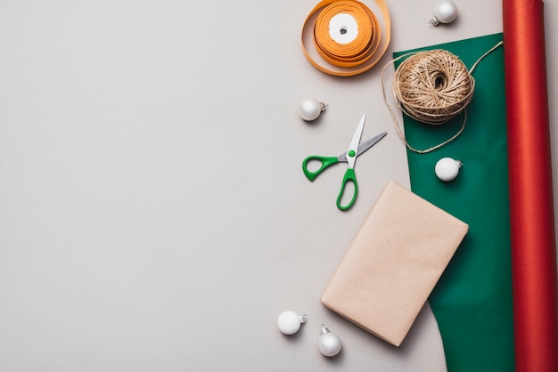 Flat lay of wrapping paper with string and scissors