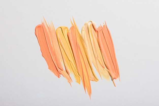 Flat lay of yellow paint brush strokes