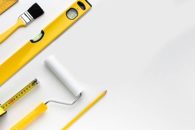 Flat lay yellow tools with copy space