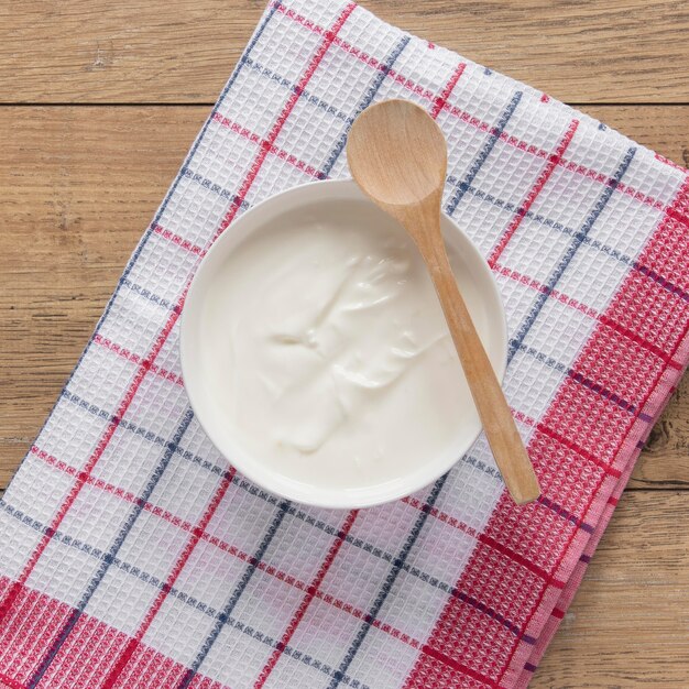 Flat lay yogurt in bowl composition