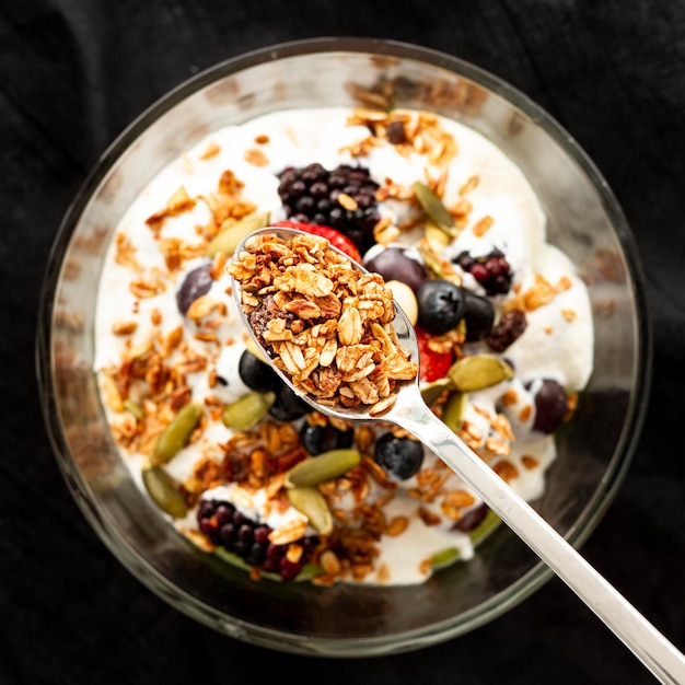 Flat lay yogurt with cereals and fruits