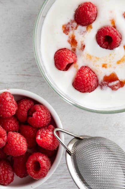 Flat lay  yogurt with raspberries