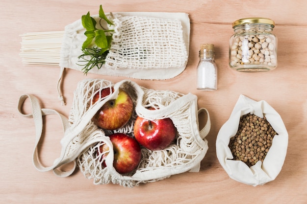 Flat lay zero waste assortment on wooden background