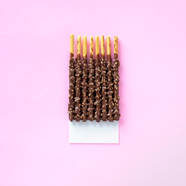 Flavor coated bread stick treats