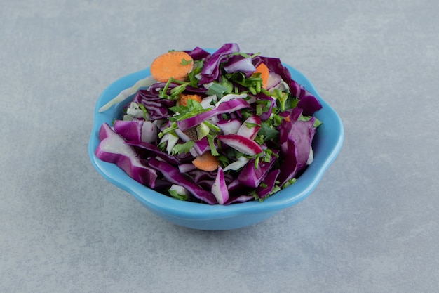 Free photo flavorful sliced vegetables in a bowl , on the marble.