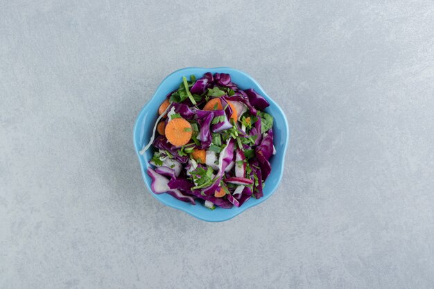 Flavorful sliced vegetables in a bowl , on the marble.