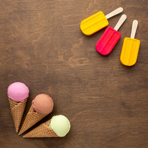 Flavoured ice cream on cones and sticks