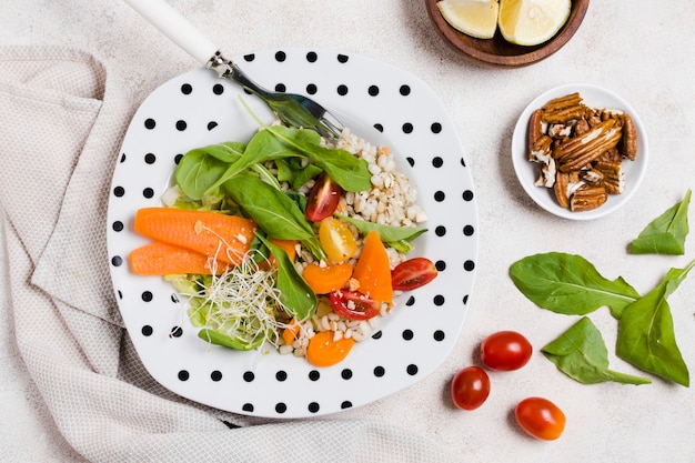 Flay lay of plate with salad and other healthy food