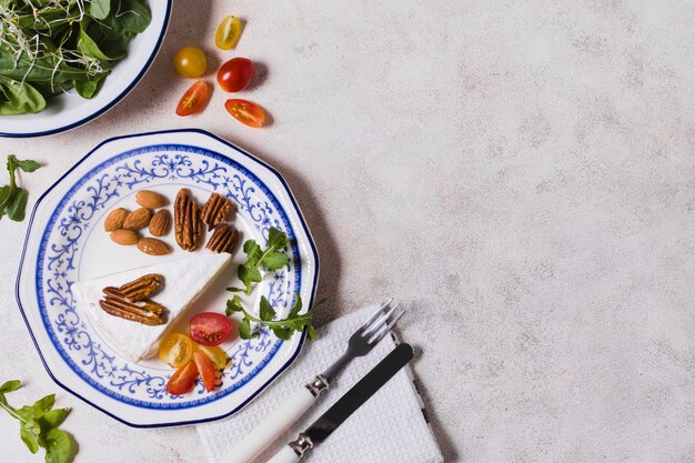 Flay lay of plate with walnuts and salad