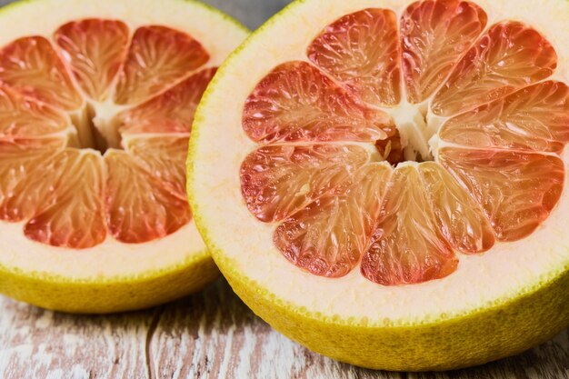 The flesh of a juicy fresh pomelo in close-up, shallow depth of sharpness