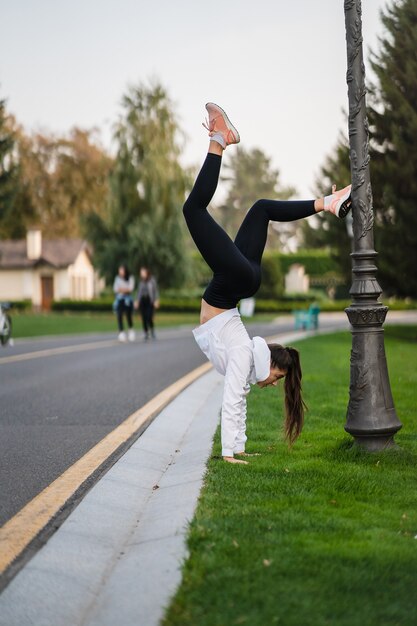 Flexible gymnast outdoors