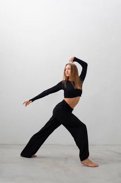 Flexible model posing in studio full shot