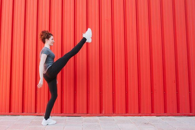 Flexible sportswoman training on street