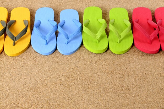 Flip flops on a sandy beach 