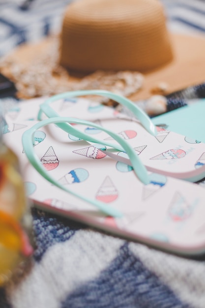 Free photo flip flops with blurred background