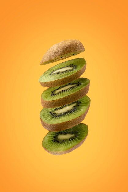 Floating sliced kiwi fruit with clear background