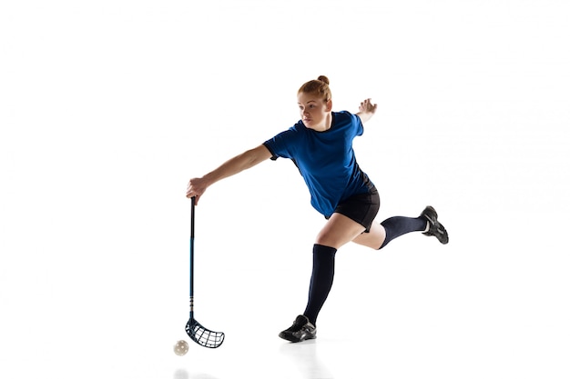 Floorball female player isolated on white, action and motion concept