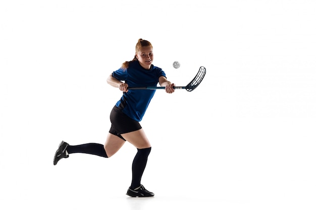 Floorball female player isolated on white, action and motion concept