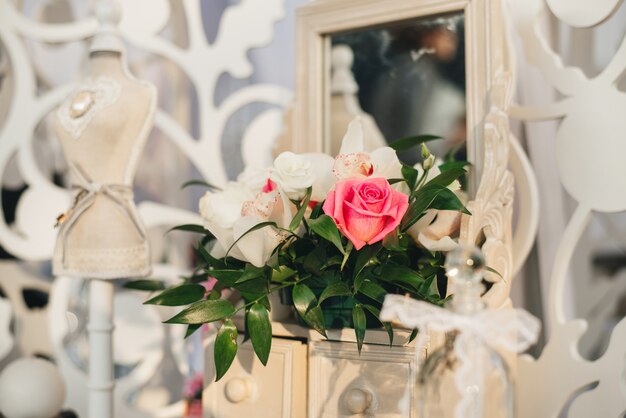 Floral Arrangement Of Pink Roses And Orchids In The Decor Of A