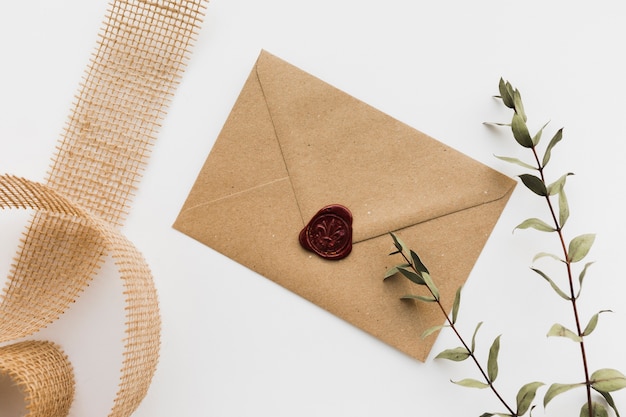 Floral branch with wedding invitation