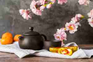 Free photo floral chinese new year decoration with tea